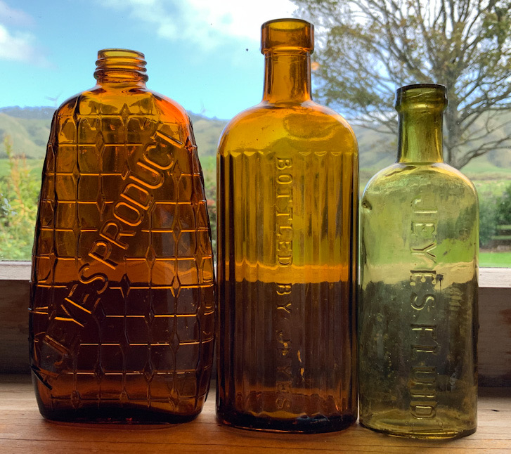 Three Antique Jeyes Fluid Glass Bottles